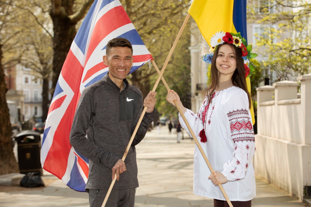 Josh Layton and Alona Udad form a symbol of British-Ukrainian unity ahead of the TCS London Marathon 2023 (Picture: Tim Anderson)